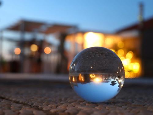 the reflection of a ball in a mirror on the ground at INTìO - natural home concept in Casale Marittimo