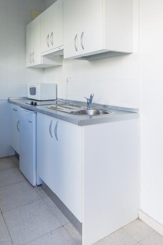 Η κουζίνα ή μικρή κουζίνα στο Apartamentos Fernando de los Rios