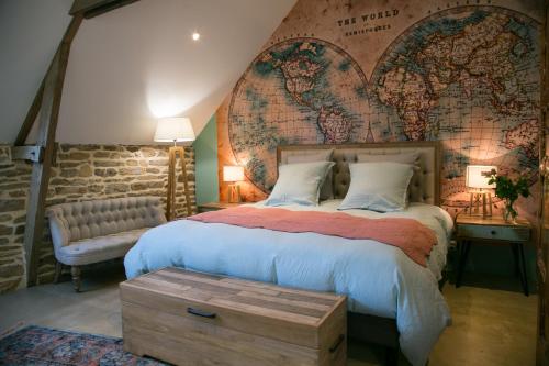 Tempat tidur dalam kamar di Les Dames de Nage