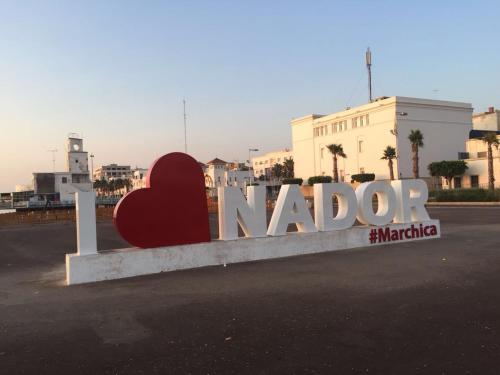 a sign that says nord with a heart on it at Marchica Apartment Nador Jadid Wifi Klima in Nador