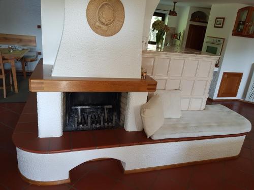 a model of a living room with a fireplace at Pr'Simi in Golnik