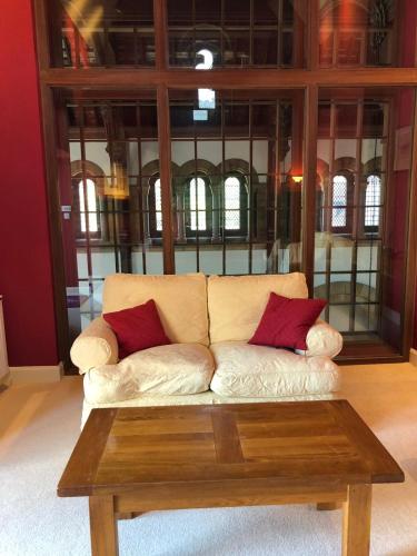 a living room with a couch and a coffee table at The Highland Club in Fort Augustus