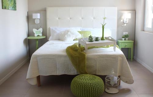 Ένα ή περισσότερα κρεβάτια σε δωμάτιο στο Apart-Hotel la Rocchetta