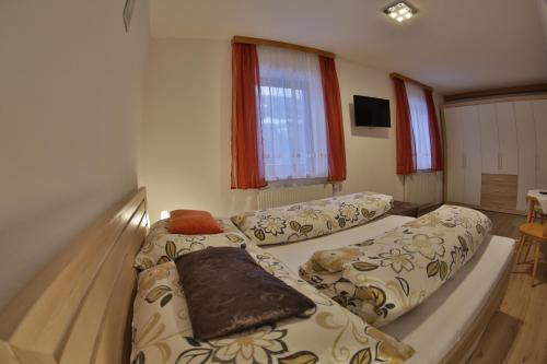 Postel nebo postele na pokoji v ubytování Haus Edlinger