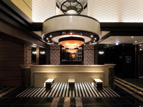 a lobby with a large organ in a building at APA Hotel Nagoya Sakae Kita in Nagoya
