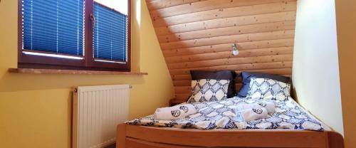 Posteľ alebo postele v izbe v ubytovaní Domek pod Antałówką