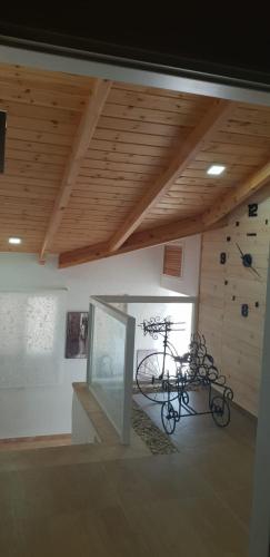 a bike in a room with a climbing wall at Amazing in Haifa