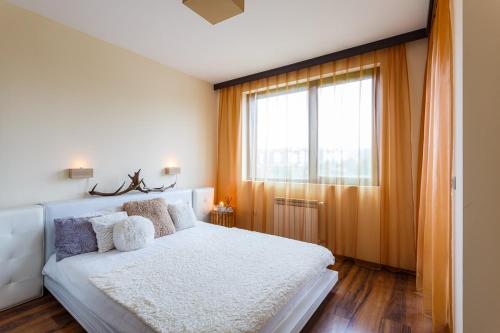 Säng eller sängar i ett rum på Top Apartment in Bansko