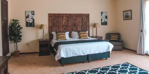 מיטה או מיטות בחדר ב-River Bird Guest House