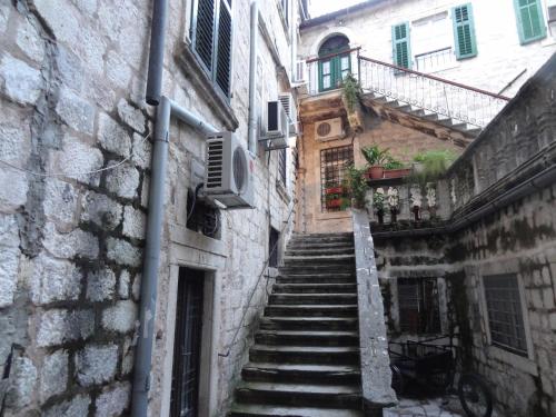 an alley with stairs leading up to a building at Apartment Palata Bizanti in Kotor