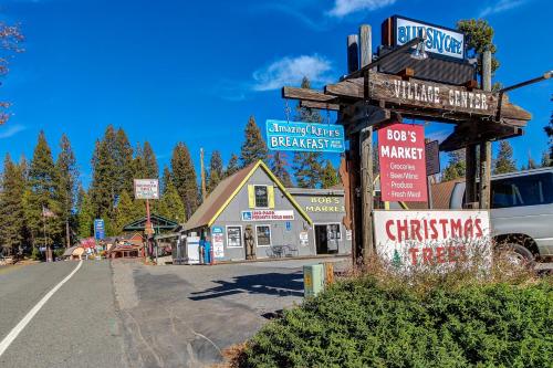 a sign for a store on the side of a street at Sparrow Cove in Shaver Lake
