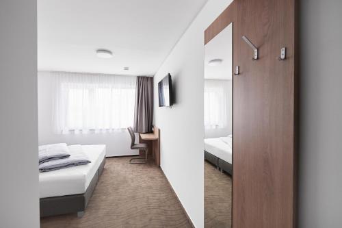 Postel nebo postele na pokoji v ubytování Hotel New In