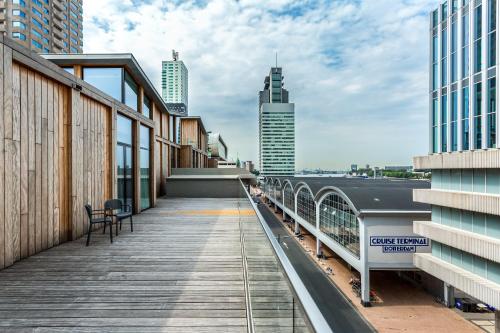a balcony of a building with a view of the city at Room Mate Bruno, Rotterdam in Rotterdam