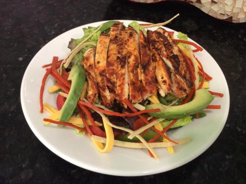 a white plate of food with a chicken salad at CHN Hotel Monterrey Santa Fe in Monterrey