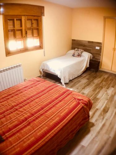 a bedroom with two beds in a room at Capellania 2 in Arroyo Frio