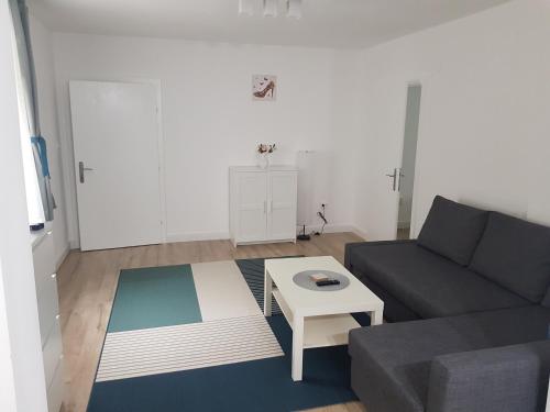 a living room with a couch and a table at Luxury Apartment in Ramingstein