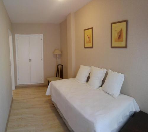 Postel nebo postele na pokoji v ubytování Hotel Las Rocas