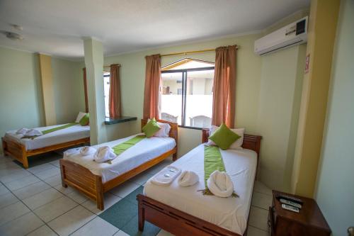 Postel nebo postele na pokoji v ubytování Hostal Andry