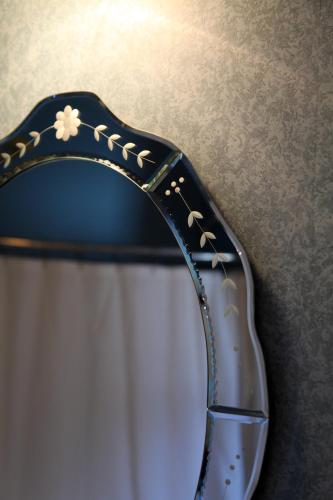 a close up of a pair of sunglasses on a table at Albergo Allegria Hotel & Breakfast Restaurant in Windham