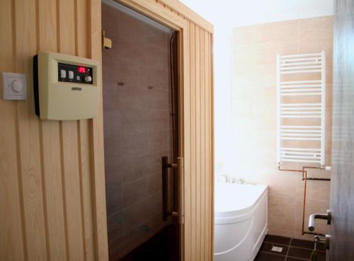 a bathroom with a toilet and a sink at Restoran sa prenoćištem Žitište in Žitište