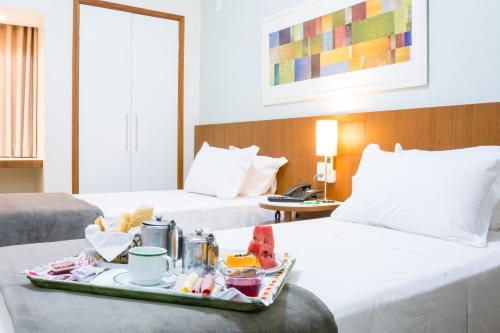 Vitoria Regia Hotel Bauruにあるベッド
