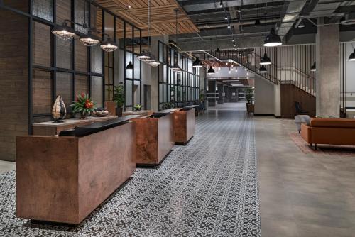 an office lobby with a row of reception desks at Hyatt Place San Pedro in San Pedro Sula
