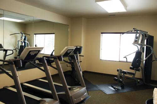 a gym with tread machines and a mirror at Extended Stay Americas Suites - Minot in Minot