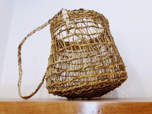 a woven basket bag on a table at El Establo in Puerto Natales