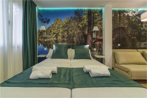 Säng eller sängar i ett rum på Hotel Ciudad del Mar