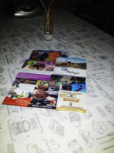 a pile of books sitting on top of a table at El Pasaje in Malargüe