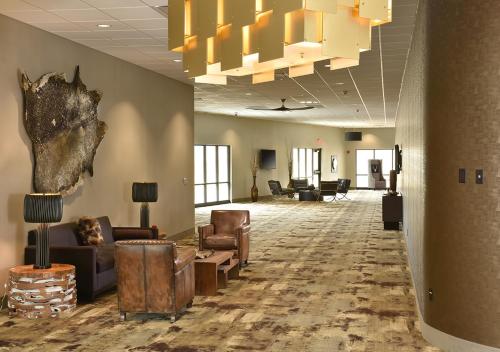 a lobby with couches and chairs in a building at Stoney Creek Hotel Tulsa - Broken Arrow in Broken Arrow