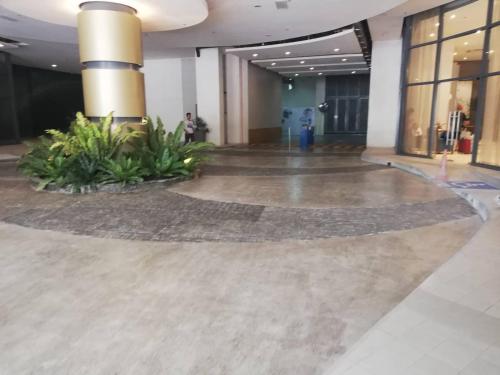 a large lobby with a large floor in a building at Nica's Place Property Management Services at Horizons 101 Condominium in Cebu City