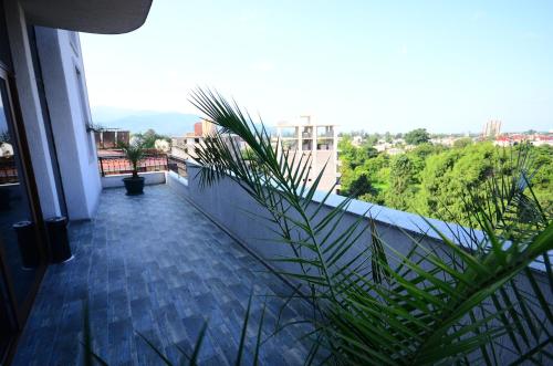 a balcony with a view of a city at Dream Tower in Batumi