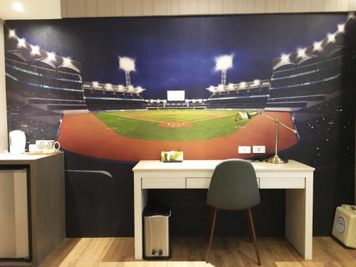 a mural of a baseball game on a wall at La Hotel-Baseball Theme Hall in Kaohsiung