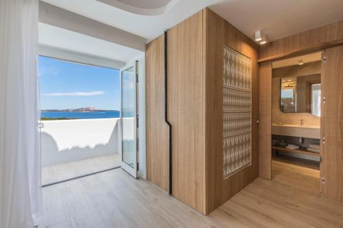 a room with a view of the ocean at Hotel Grand Relais Dei Nuraghi in Baja Sardinia