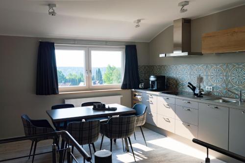 Η κουζίνα ή μικρή κουζίνα στο StrandBerg's Auberge Chalet Residences