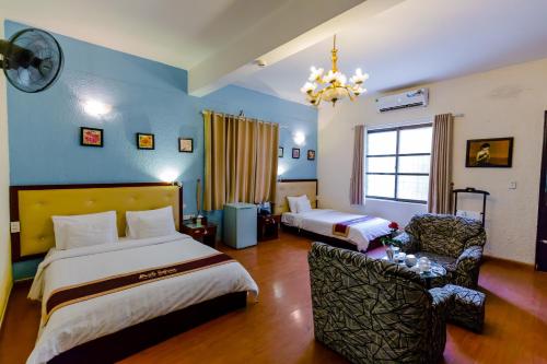 Giường trong phòng chung tại A25 Hotel - Hoàng Quốc Việt