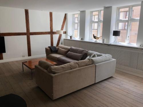 a living room with a couch and a table at K10 Apartments in Copenhagen
