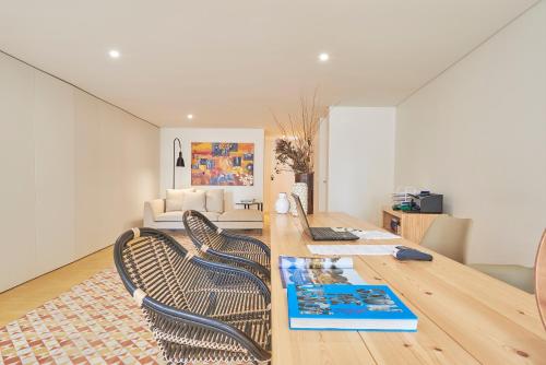 a living room with a wooden table and chairs at Lisbon Best Choice Prime Apartments Alfama in Lisbon