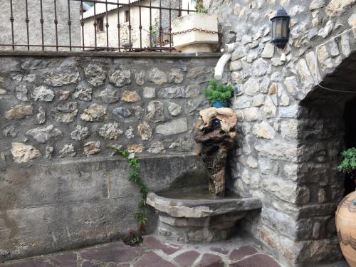 a stone wall with a water fountain on it at Casa Ramón El Pallé in Sin