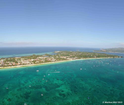 an aerial view of an island in the ocean at DiveGurus Boracay Beach Resort in Boracay