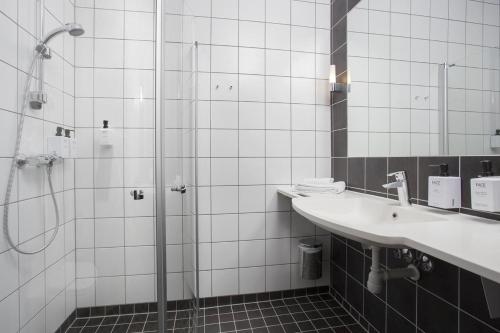 a bathroom with a sink and a shower at Gardenview Room in Madla