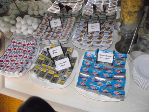 a table topped with lots of different types of food at Olimpiyat Hotel Izmir in Izmir