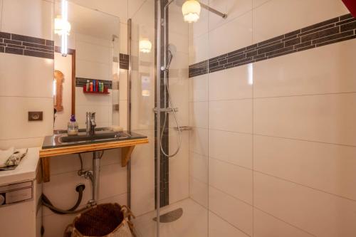 a bathroom with a shower and a sink at Marquis 5 in Morzine