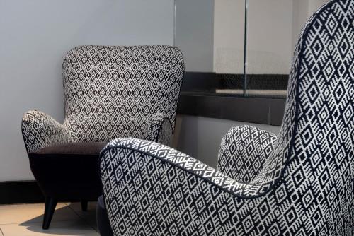 a chair with a black and white pattern on it at Ten Hill Place in Edinburgh