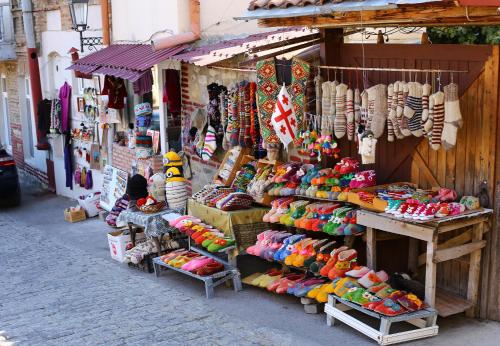 a store with a large display of shoes and other items at Dzveli Ubani in Sighnaghi