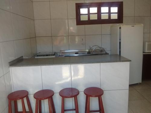 A kitchen or kitchenette at Residencia Siqueira