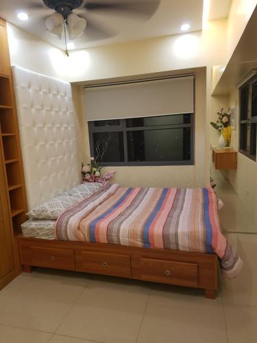 Postel nebo postele na pokoji v ubytování KC 2-Bedroom 1 at Horizon 101 Cebu