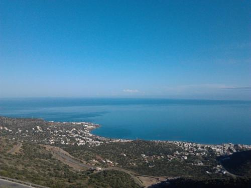 an aerial view of a city and the ocean at Diamond Beach Apts & Studios in Stalida
