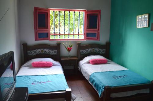 Finca Hotel Pueblito Quindianoにあるベッド